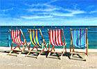 A painting of deck chairs on the prom at Lyme Regis, Dorset by Margaret Heath.