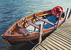 A painting of the ferry boat to Walberswick on the River Blyth, Suffolk by Margaret Heath.