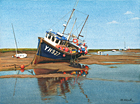 A painting of a fishing boat at low tide at Wells-next-the Sea, Norfolk by Margaret Heath.