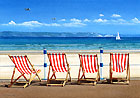 A painting of deck chairs on the prom at Weymouth, Dorset by Margaret Heath.